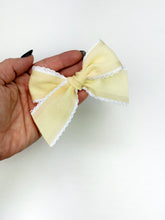 Load image into Gallery viewer, Maeve | Textured Pale Yellow Ruffle Bow | Standard | Right Clip
